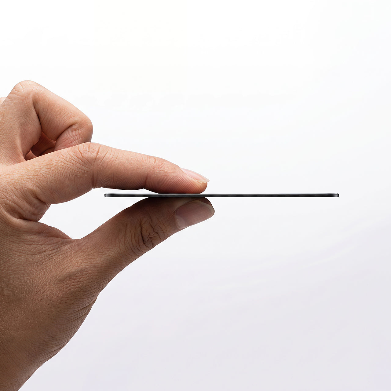 The ultra-thin Top Rabbit Tracking Slim Card held between two fingers to show its slim profile