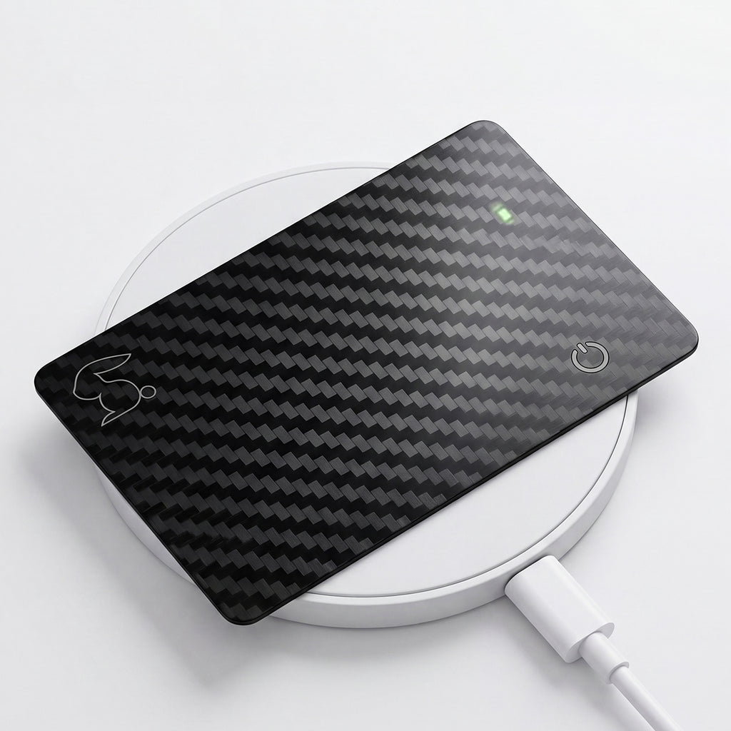 Top Rabbit Tracking Slim Card recharging on a Qi wireless charger — up to 8 months of battery per charge